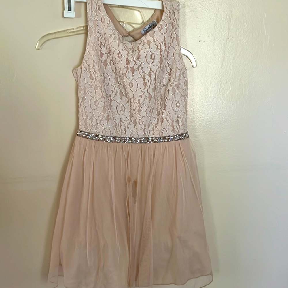Gently used. Small stain in the front portion of the skirt